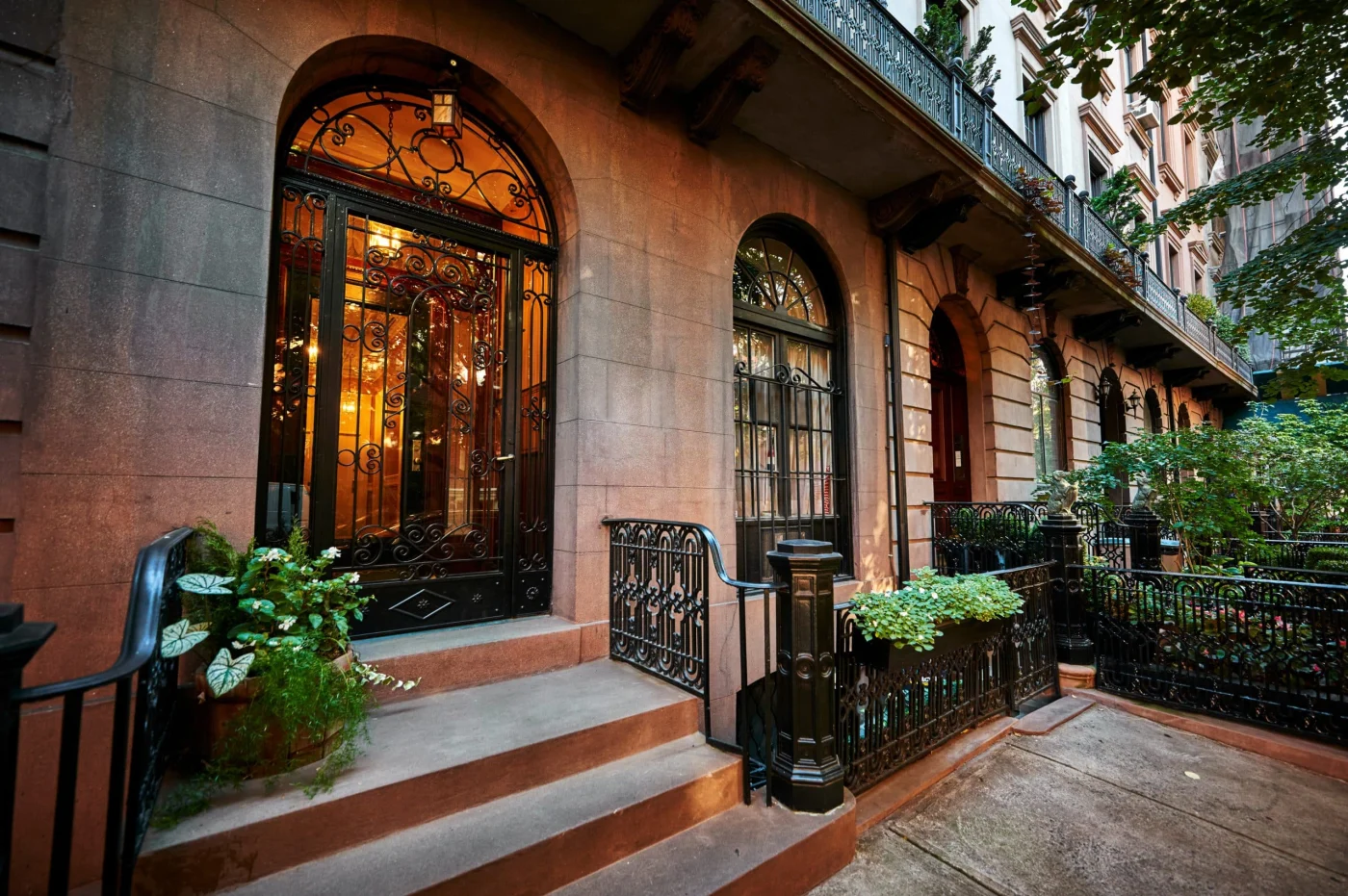 The Front Steps And Door Of An Ornate Brownstone Building