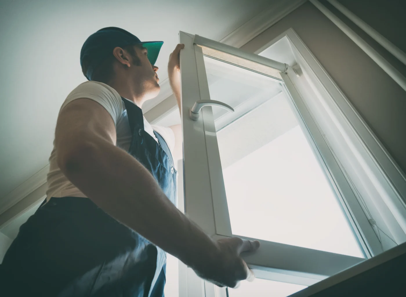 Contractor installing widow