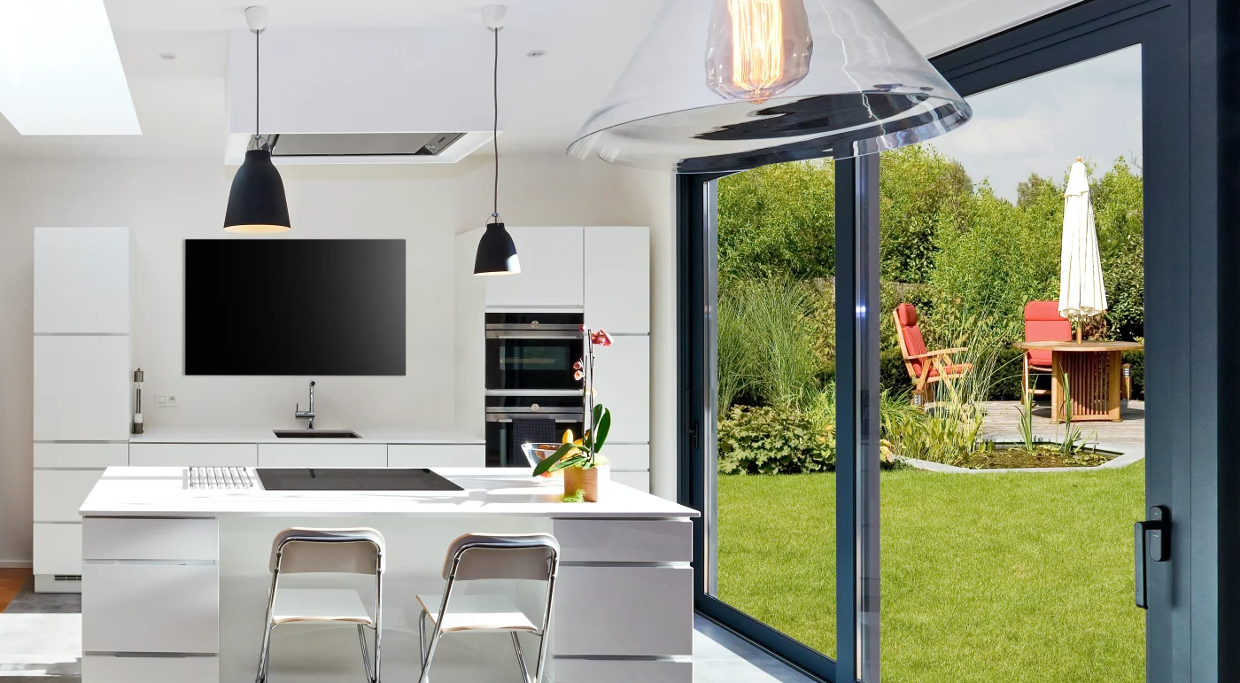 Sliding glass door off kitchen to grass patio area