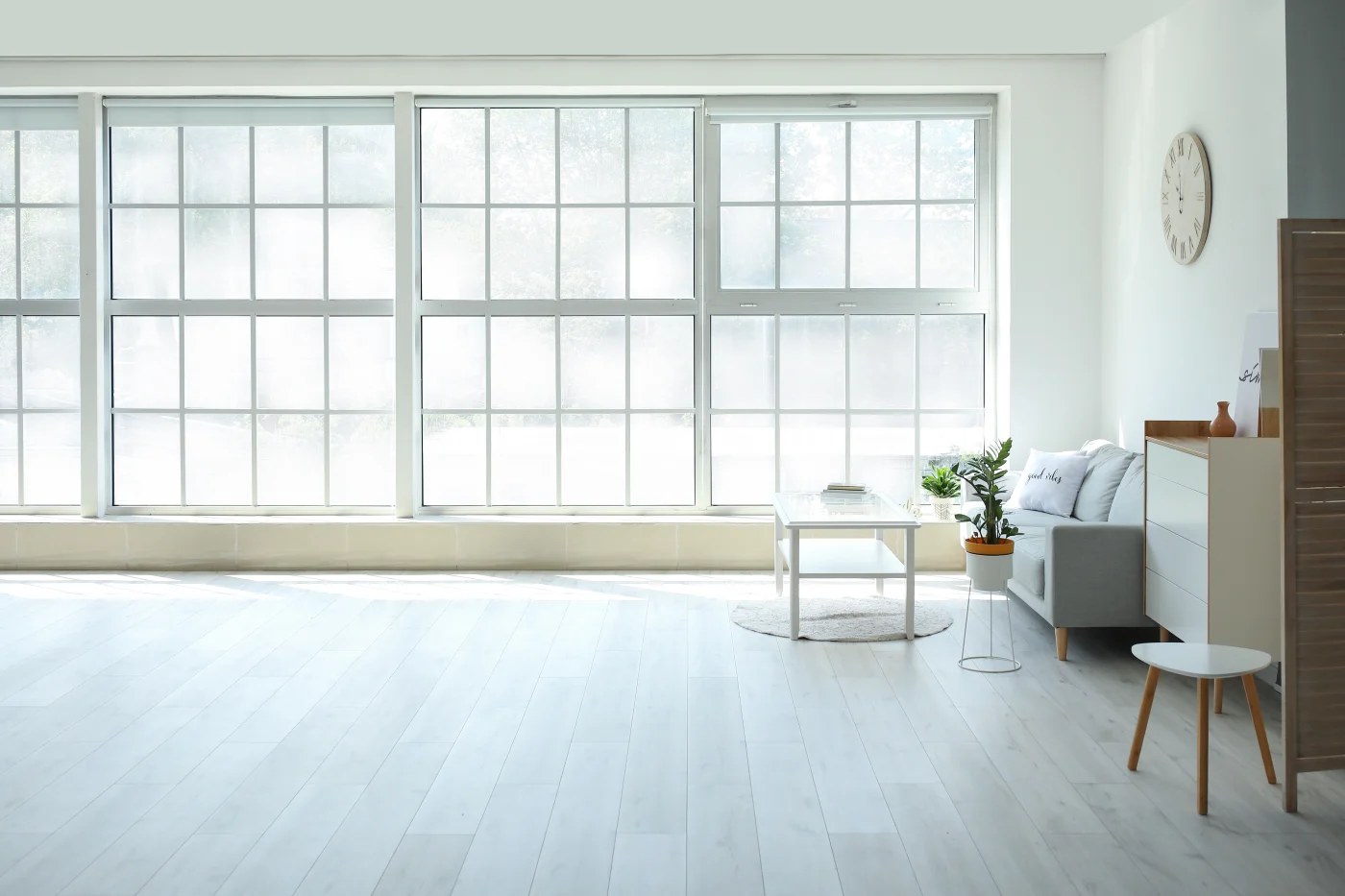 Sparse room with large windows across wall
