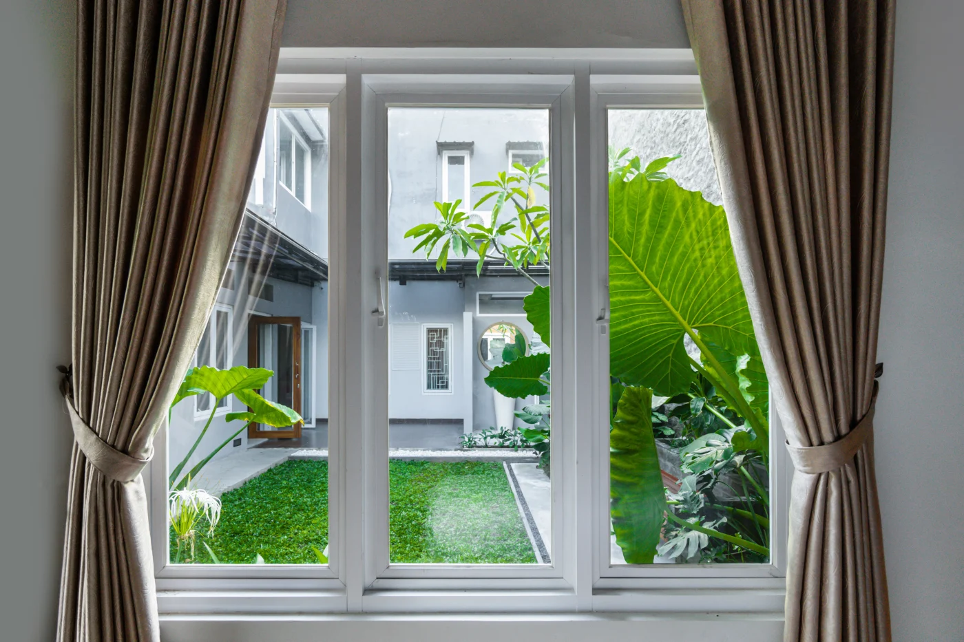 Florida window from inside with courtyard and plants outside