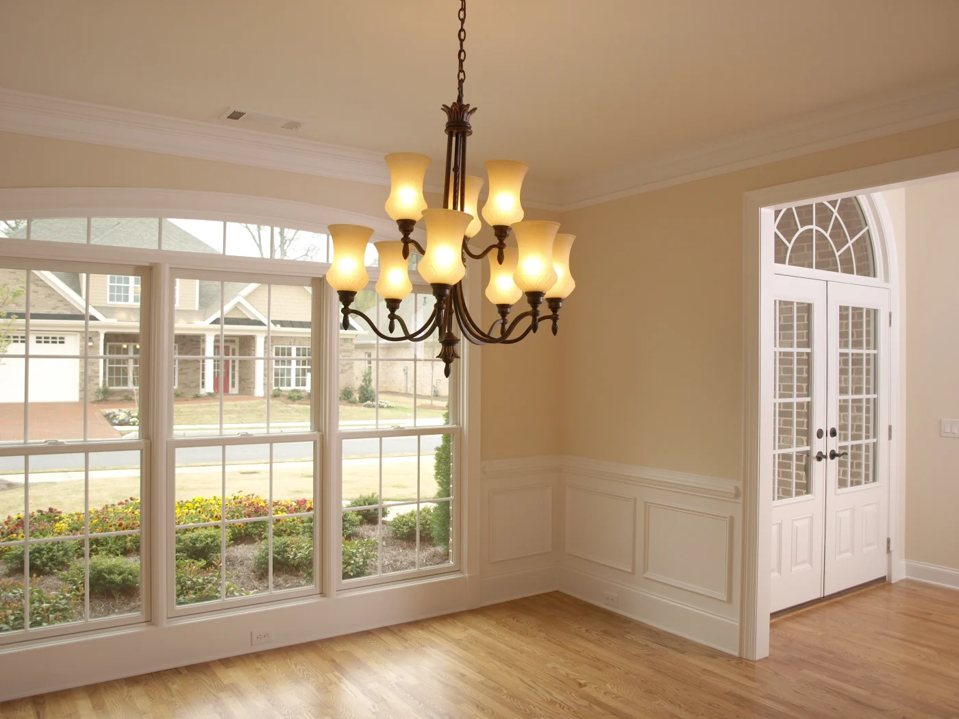Living room with spacious windows overlooking residential street