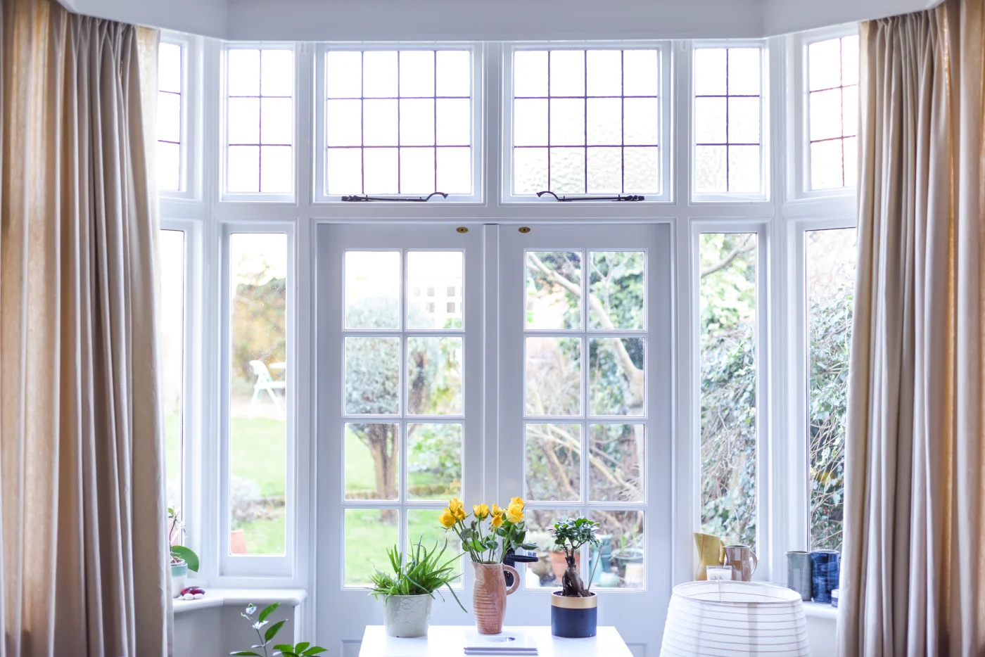 Patio with white French doors and spacious windows
