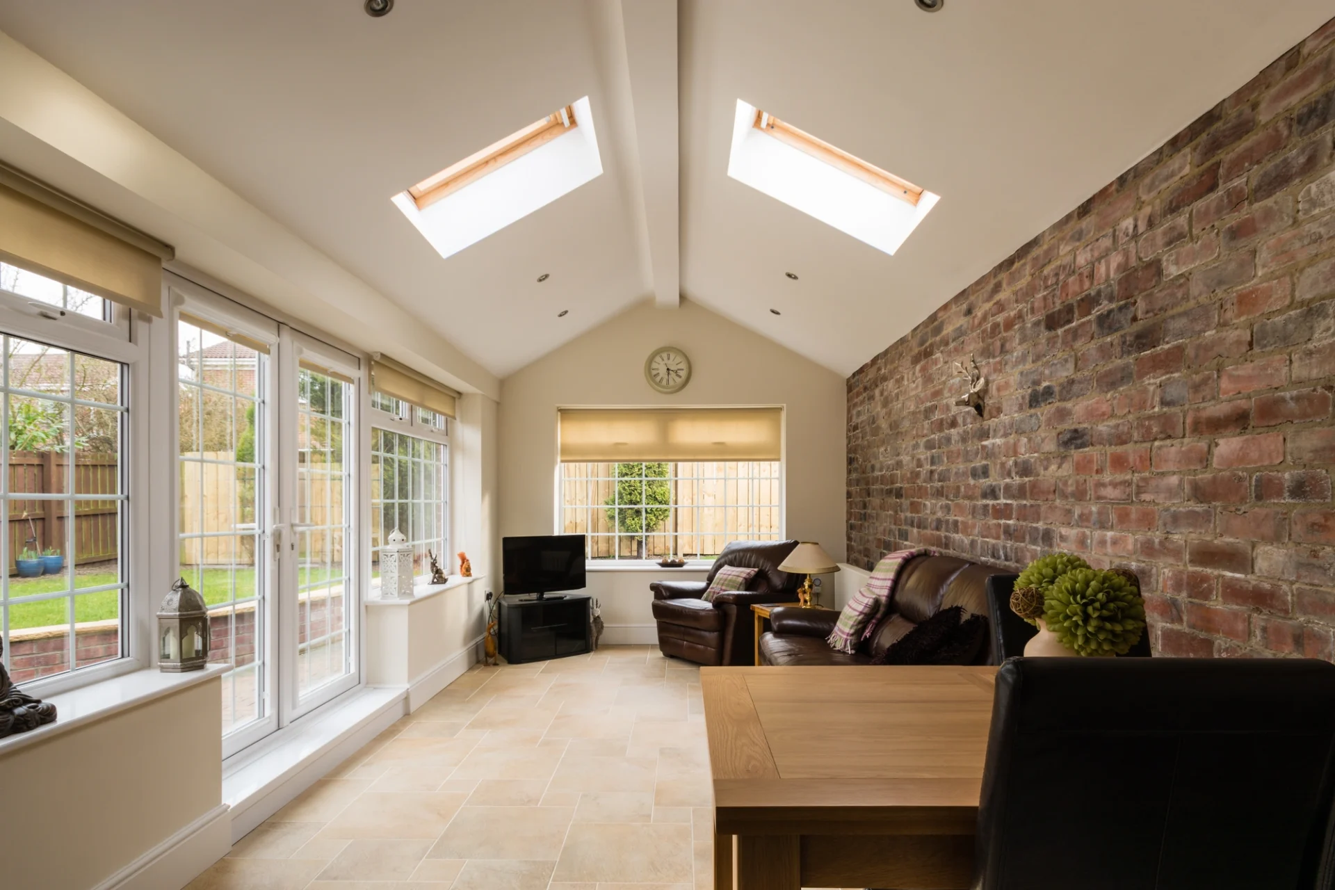 An Ortega Forest sunroom boasts a beautiful new set of French patio doors