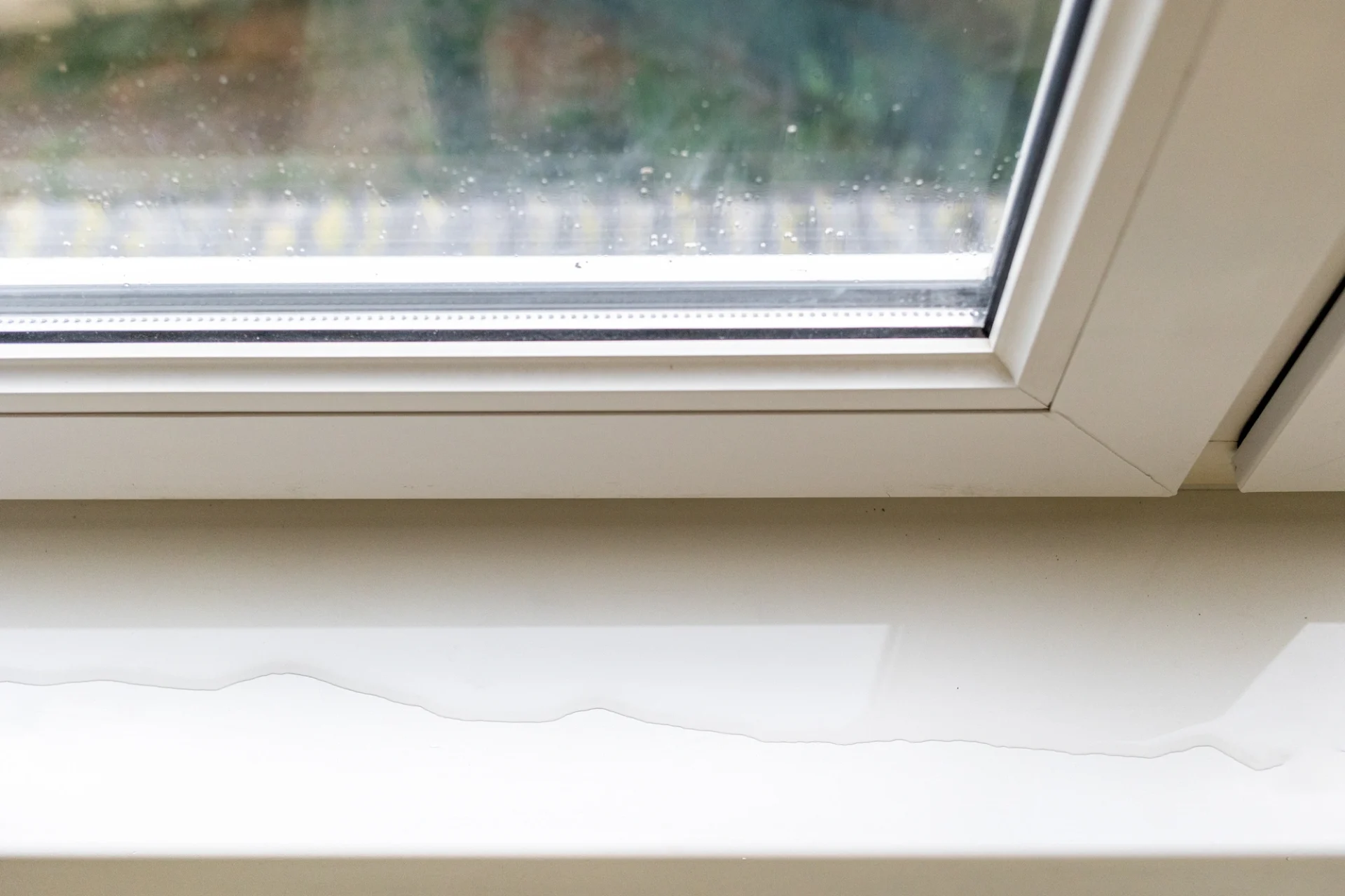 Long Lasting Replacement Windows Mandarin Fl Jacksonville Doors And Windows Water pools on the sill of a white vinyl window