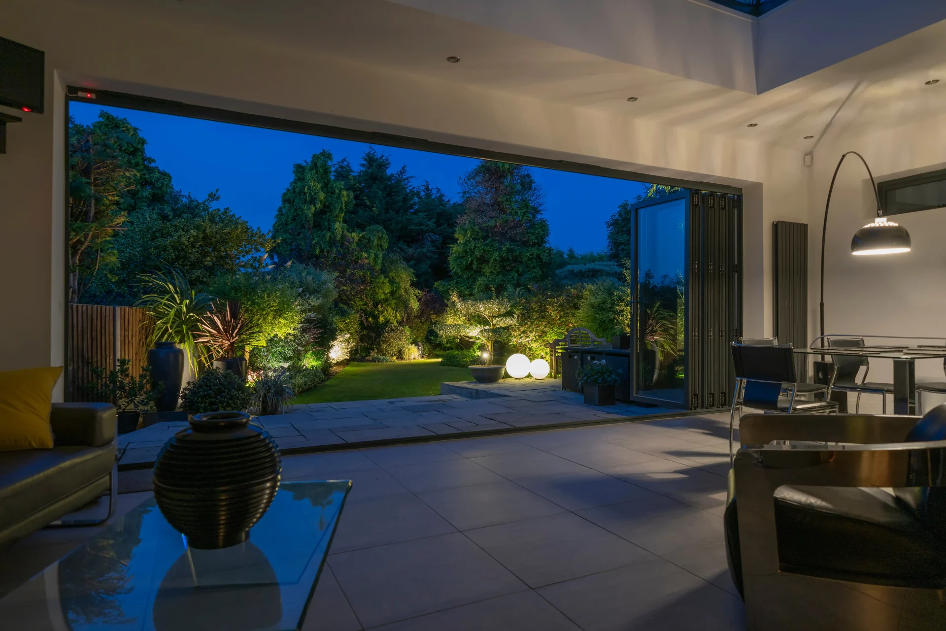 A set of bi-fold patio doors open up a room to the patio, creating seamless transitions for garden parties and patio living.