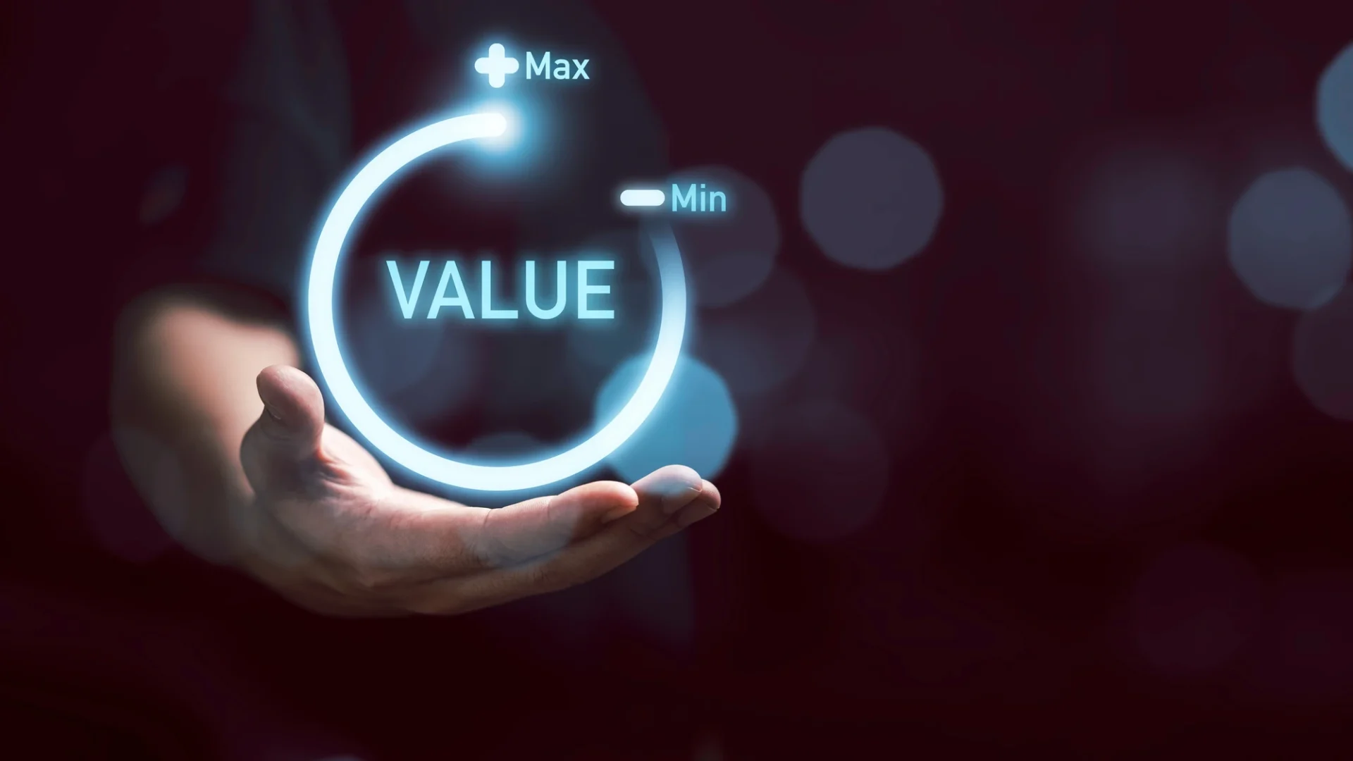 A man holds a circular, virtual meter with the word “value” at the top end.