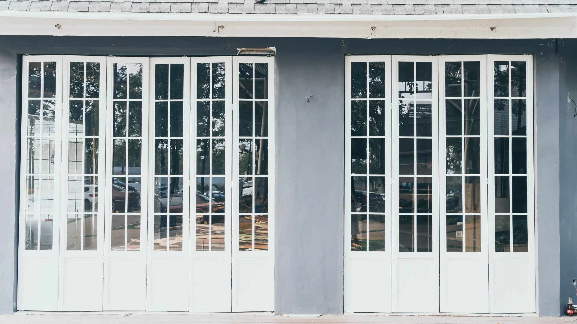 Home with two large bi-fold doors with white frames