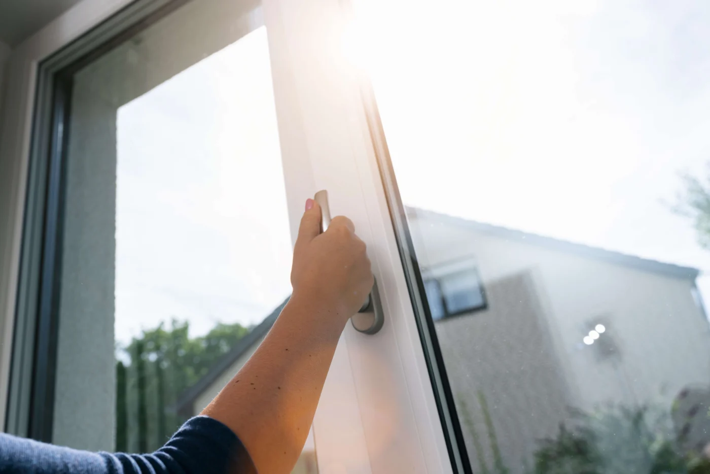 A wide-angle view of new replacement windows stretching across the back of the home.