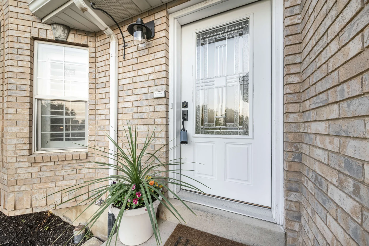 White fiberglass entry door with decorative glass