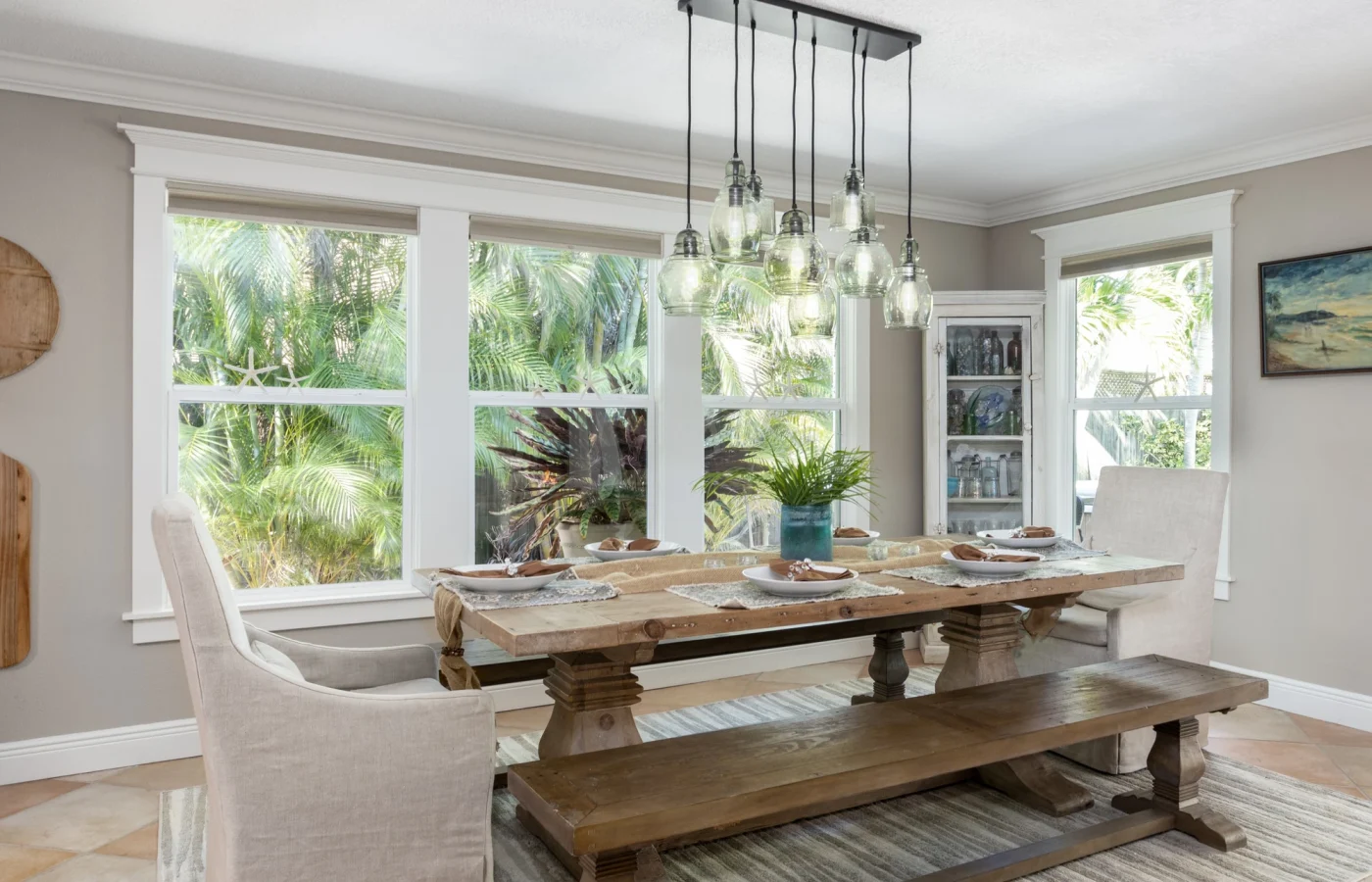 Interior view of dining room in Julington Creek home with large, white-framed windows