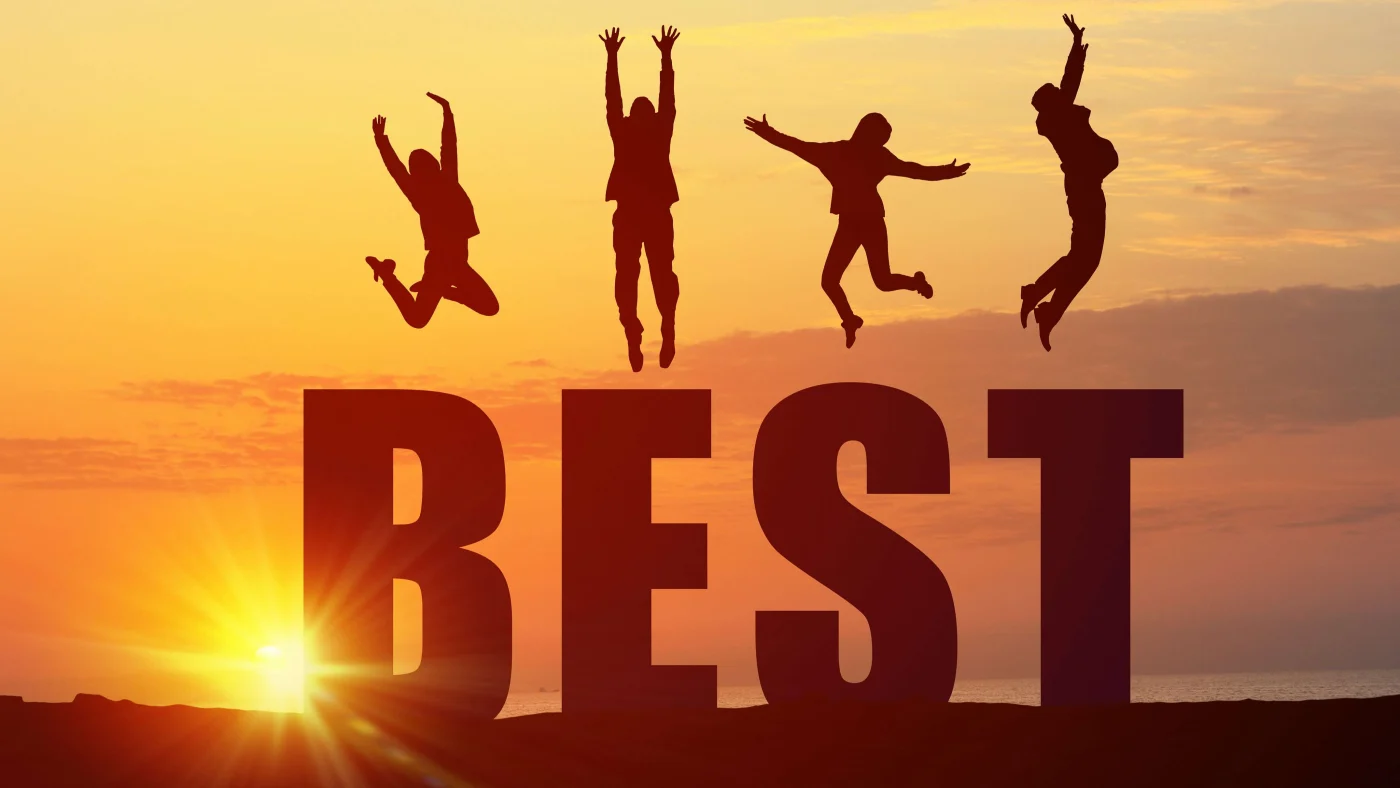 Cooperate For Successful Work The word “best” in large block letters against a setting sun background with the silhouette of a person leaping up above each letter.