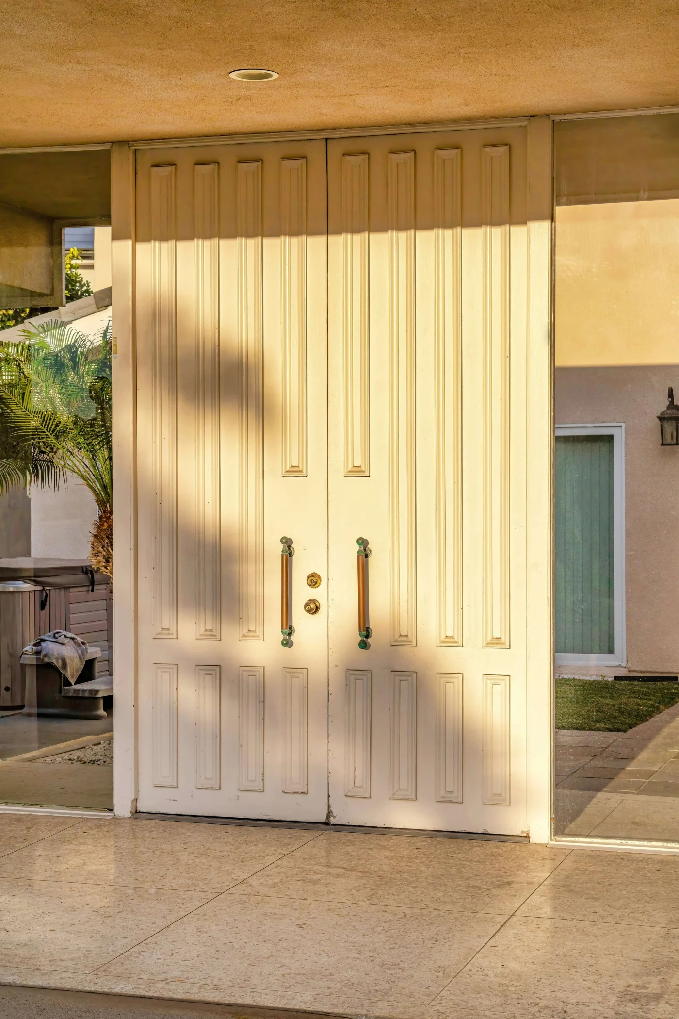 Large White Double Door Of House With Glass Wall In Huntington Beach Califronia Large White Double Door Of House With Glass Wall In Huntington Beach Califronia