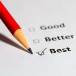 A pencil and checkboxes on a piece of paper for the words good, better, and best. The box next to the word “best” is checked.