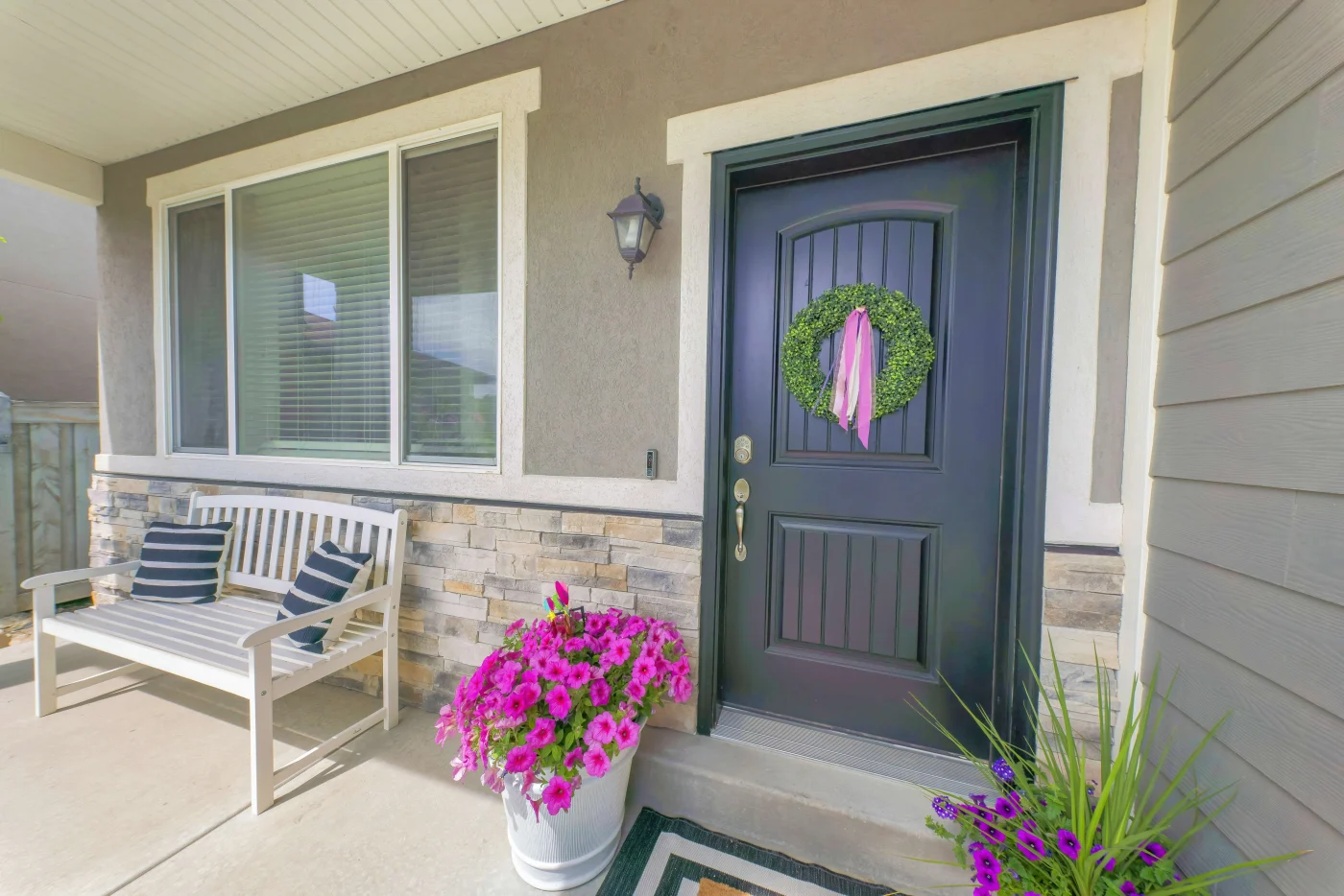 A sturdy fiberglass blue entry door on a suburban Jacksonville Beach home.