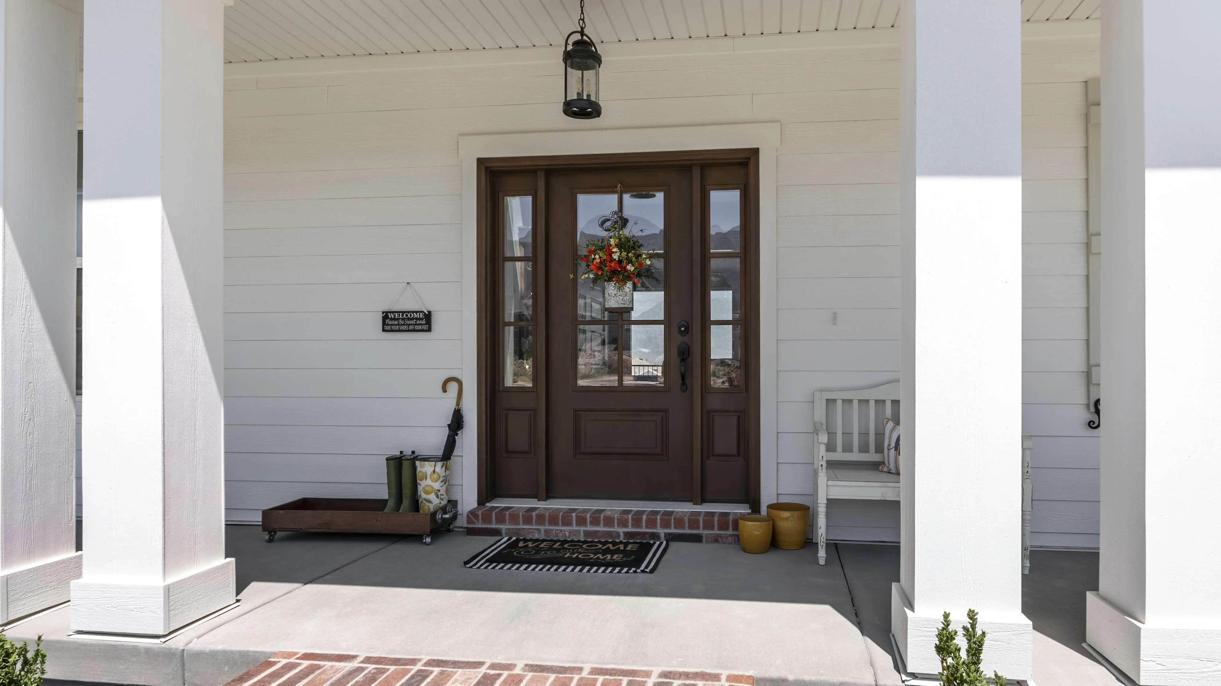 Stunning San Jose, FL Front Entry Replacement Doors A dark wood front entry door with sidelights and a transom.