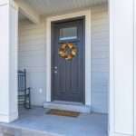 A new gray entry door with a wreath on a home in Palm Coast, FL