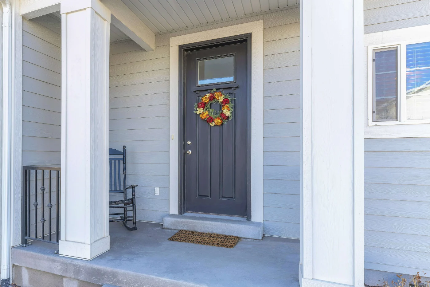Energy Efficient Door Replacements Palm Coast Fl Jacksonville Doors And Windows A new gray entry door with a wreath on a home in Palm Coast, FL