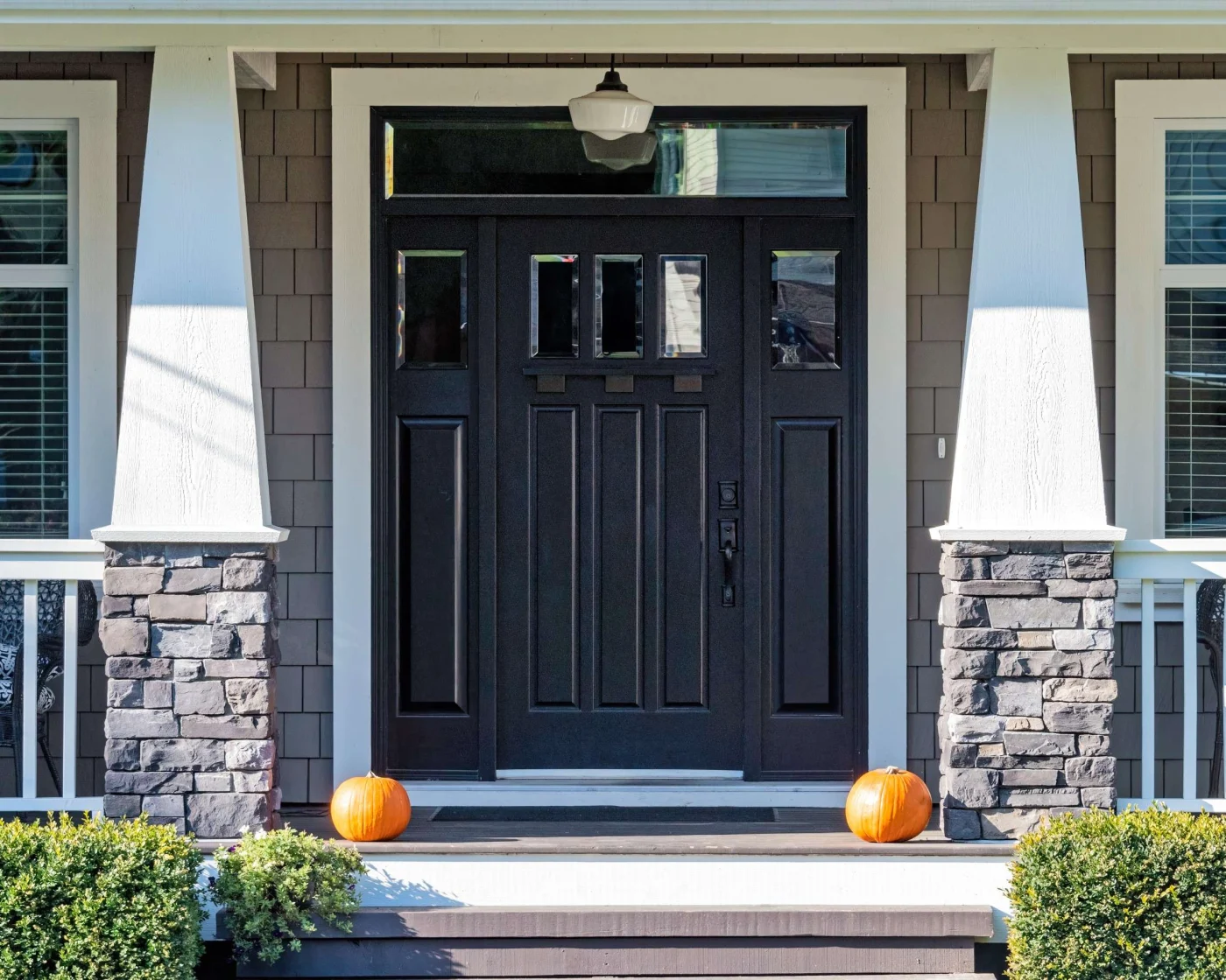 Expert Replacement Doors in Vilano Beach, FL | Jacksonville Doors & Windows A new navy blue front entry door with glass sidelights.