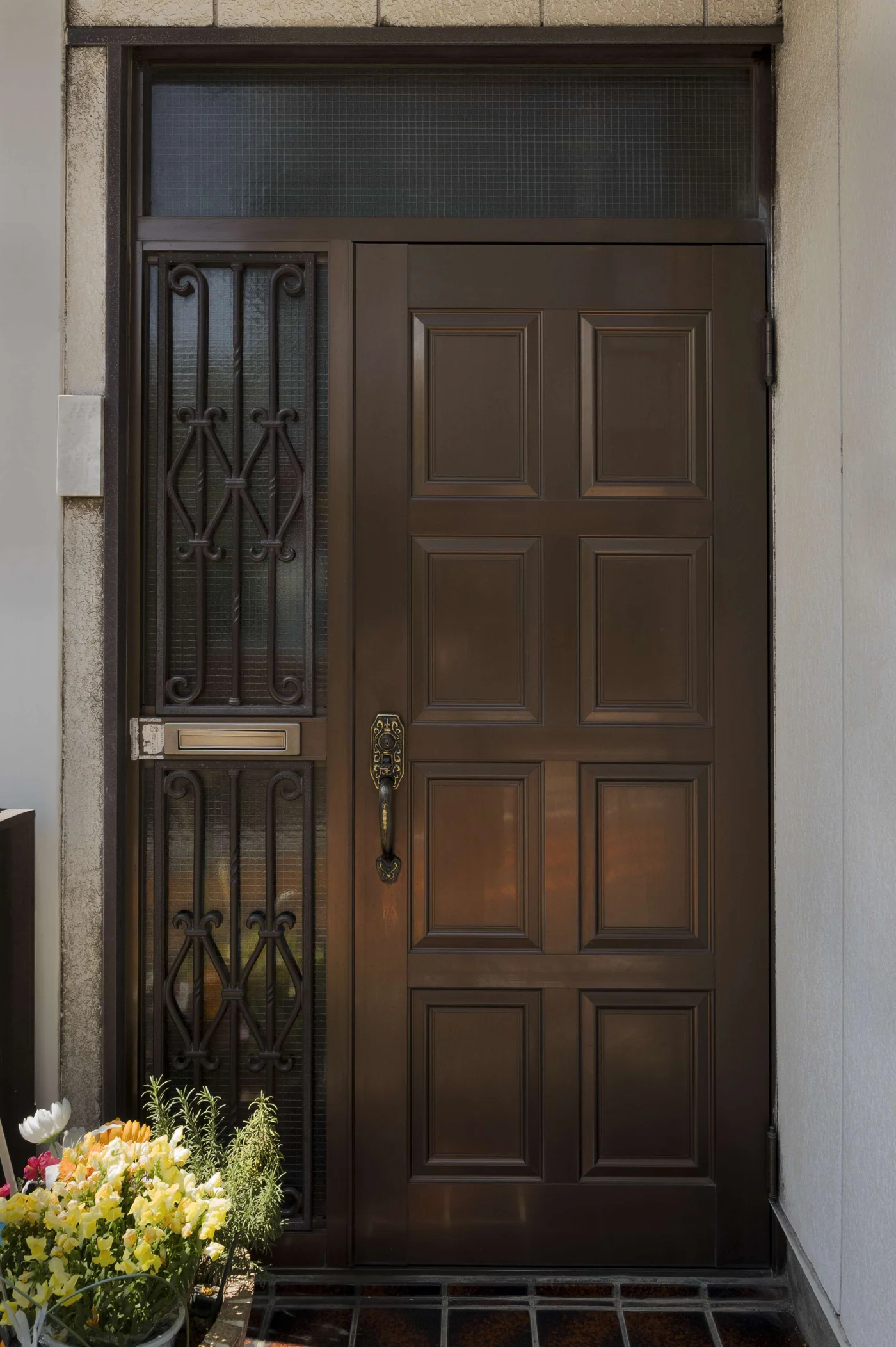 Amazing Iron Doors in Jacksonville, FL | Jacksonville Doors & Windows An entryway of a north Florida home with an iron door and wrought iron bars over the sidelights.