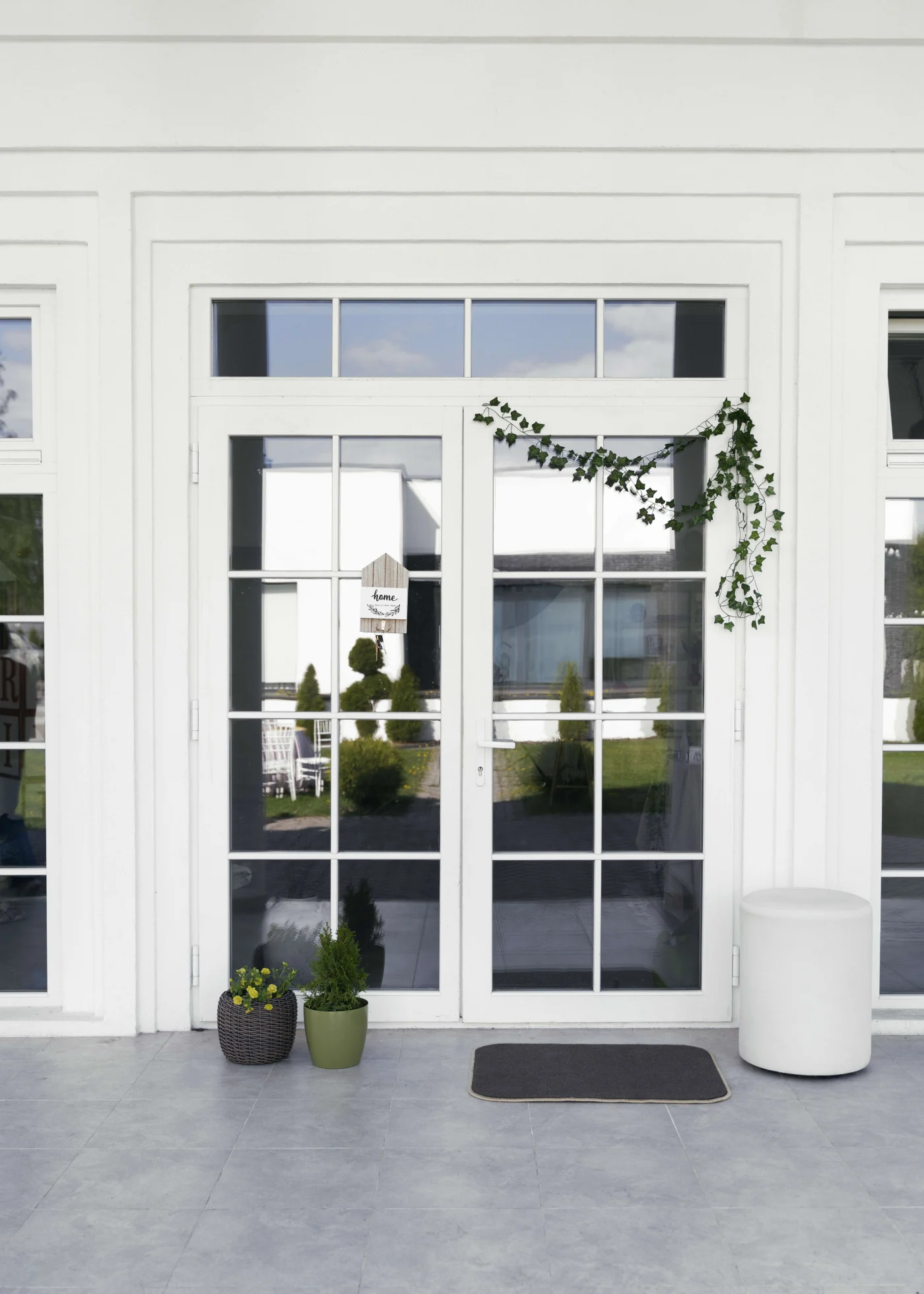 Exceptional Patio Door Replacements in Jacksonville, FL | Jacksonville Doors & Windows White French patio doors with colonial grids.