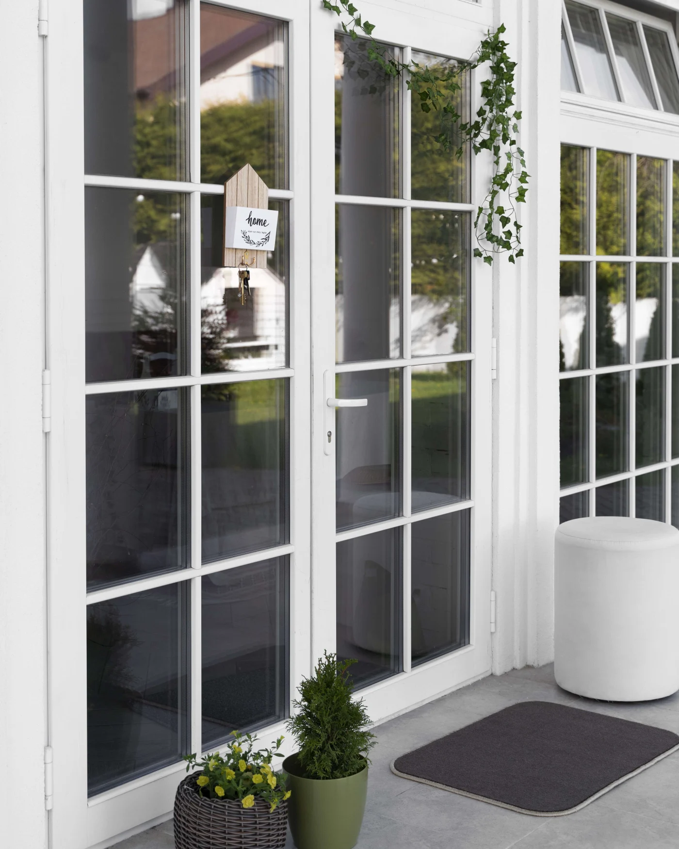 Great French Patio Doors in Jacksonville, FL | Jacksonville Doors & Windows White French patio doors with colonial grids on a Jacksonville, FL home.