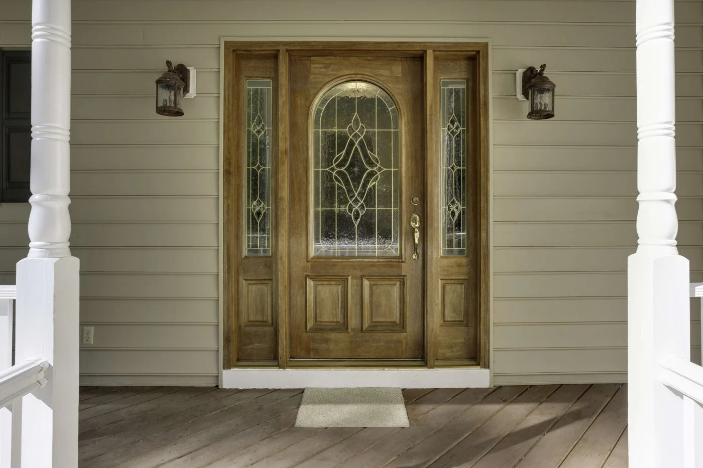 Lovely Door Replacements in Jacksonville Beach, FL | Jacksonville Doors & Windows A new iron front entry door with glass inserts and sidelights.