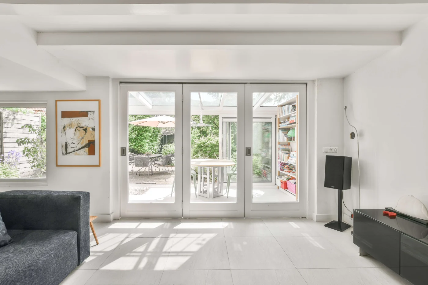 Stunning Patio Doors in Nocatee, FL | Jacksonville Doors & Windows Patio doors with glass inserts overlooking a sunny patio in Nocatee, FL.