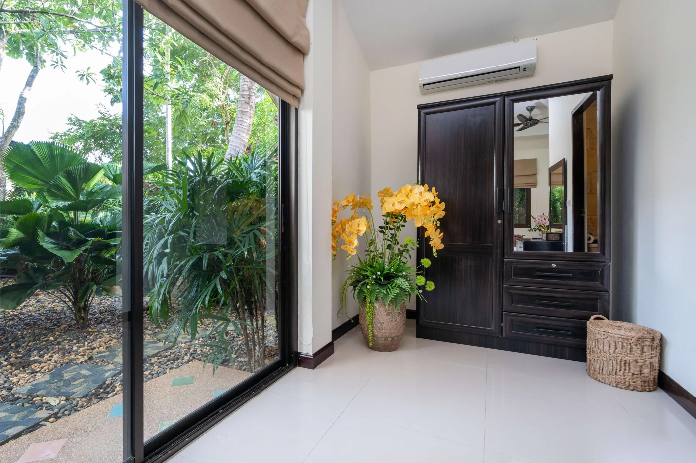 A patio area with a sliding, black-framed patio door.