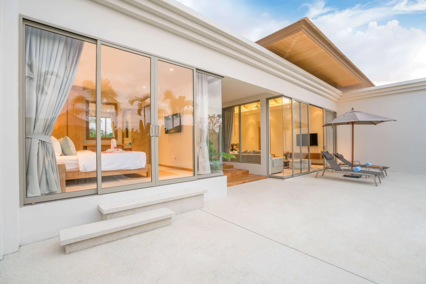 A home with a spacious patio area and sliding patio doors.